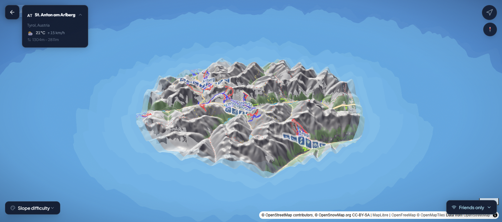 Velmigo live resort map showing St. Anton, its pistes, resort card, GPS control, compass, and slope difficulty legend